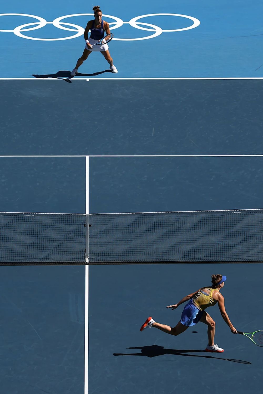 Two Tennis Players Competing Against Each Other In The Olympics