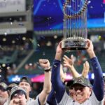Atlanta Braves Player Lifting The Baseball Championship Trophy
