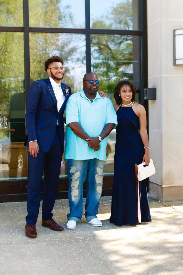 Isaiah Livers With His Father & Sister