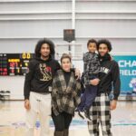 Julian (Right) With His Twin Brother, Younger Brother And Mother