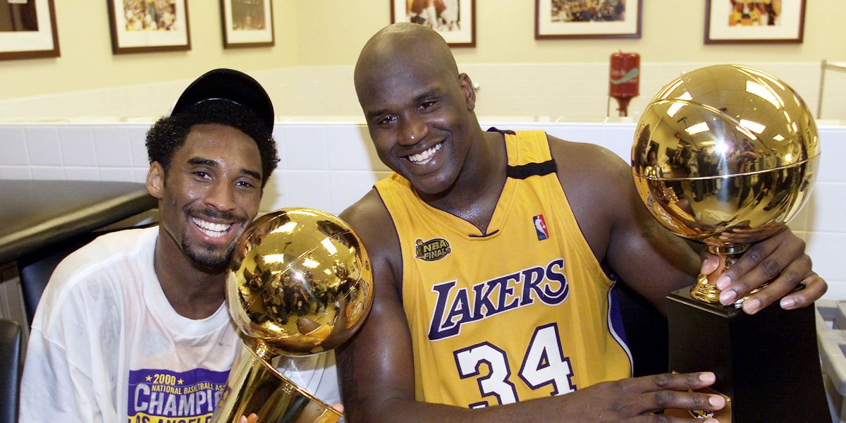 Late Kobe Bryant And Shaquille O'Neal Flaunting Their Trophy
