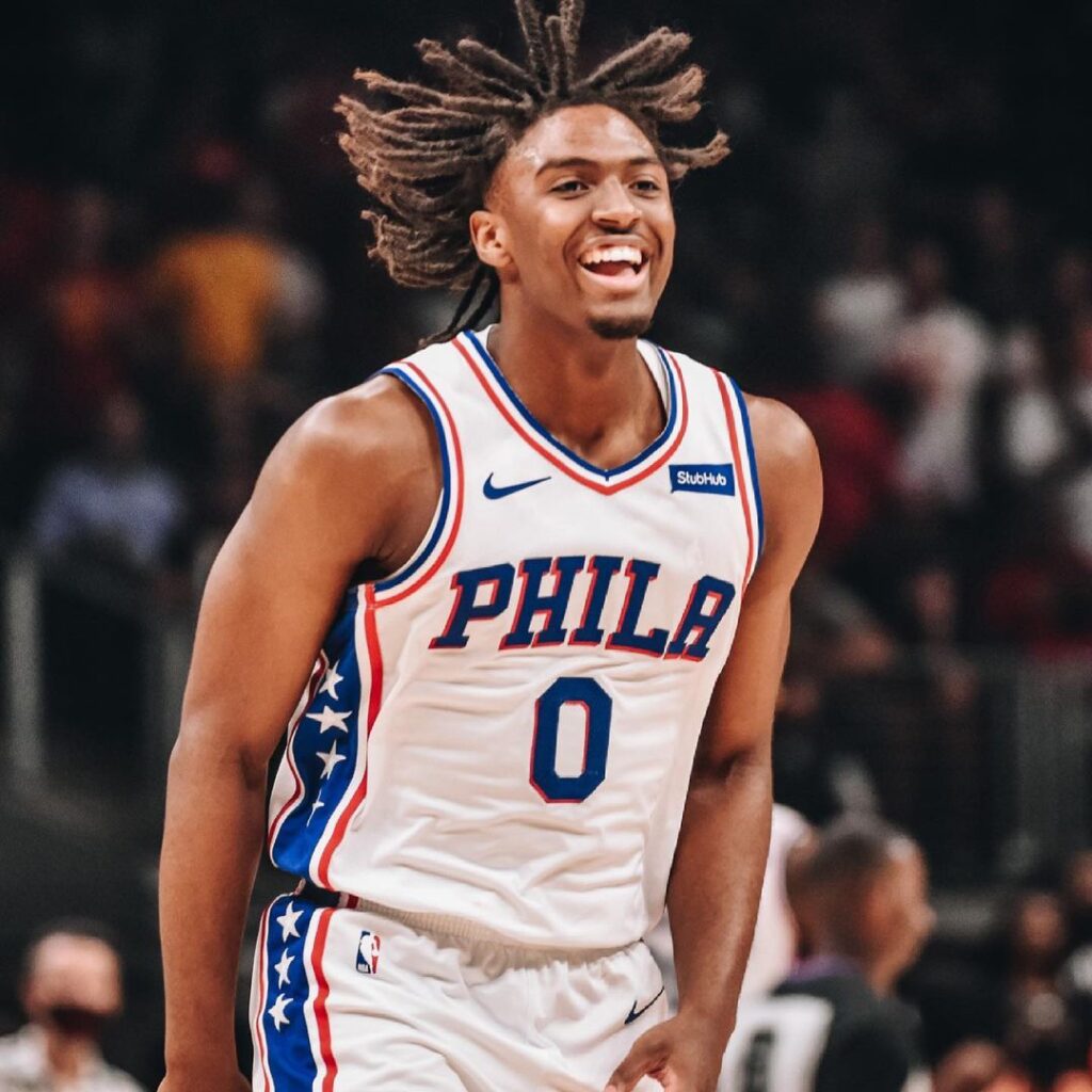 Tyrese Maxey's eye-catching Dreadlocks swinging as he plays on the court