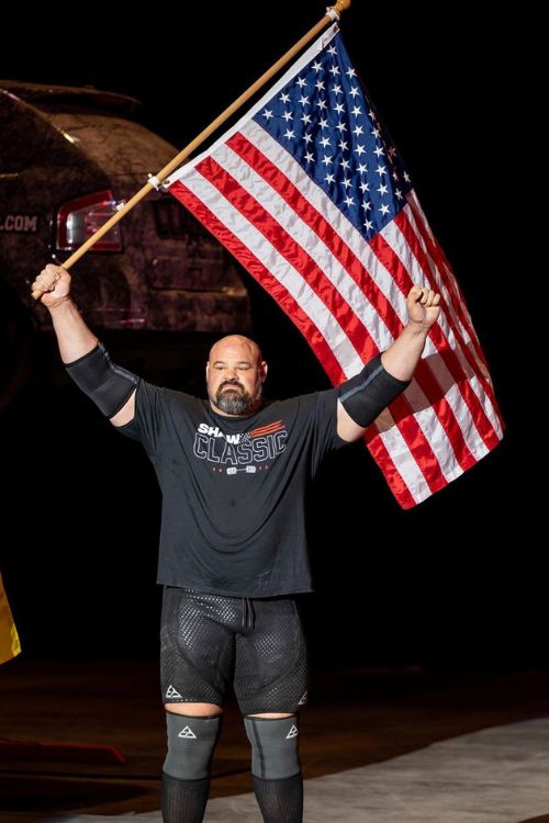 Brian Shaw Raising The Flag Of The United States Of America
