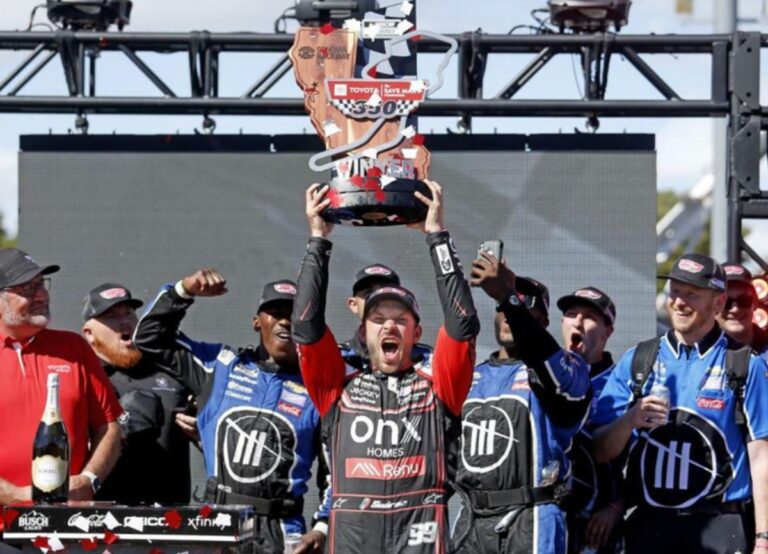 Daniel Suarez Celebrating With His Team