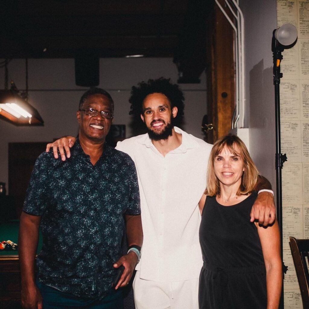Derrick With His Father And Mother