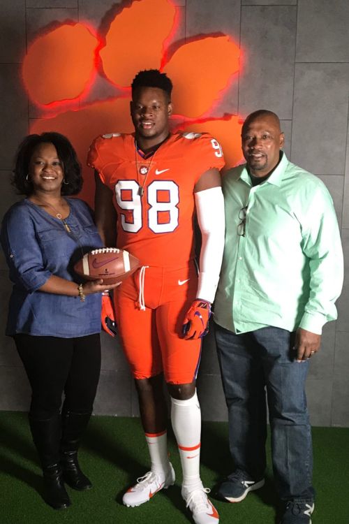 Myles Murphy With His Parents In Clemson Tigers Jersey