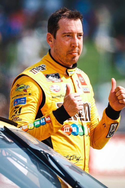 Kyle Busch Gives A Thumbs Up To The Fans During A Racing Event In 2021
