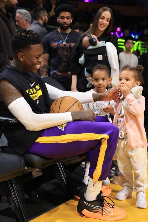 Dennis Schroder Pictured With His Wife Ellen And His Three Kids During A Basketball Game