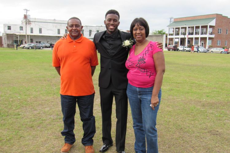 Jabari Ashe Pictured Next To His Parents Nikki And Mike Ashe