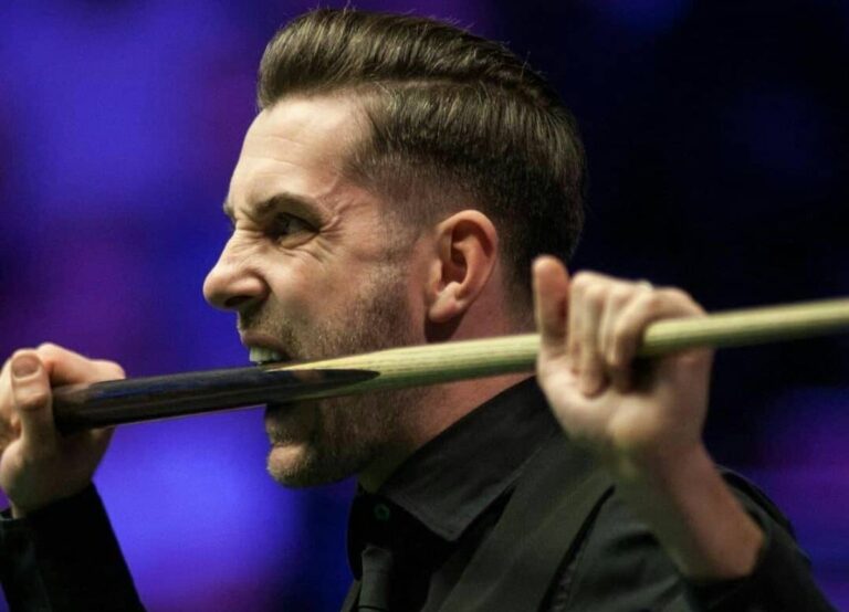 Mark Selby Bites Into His Cue Stick During An Ongoing Game