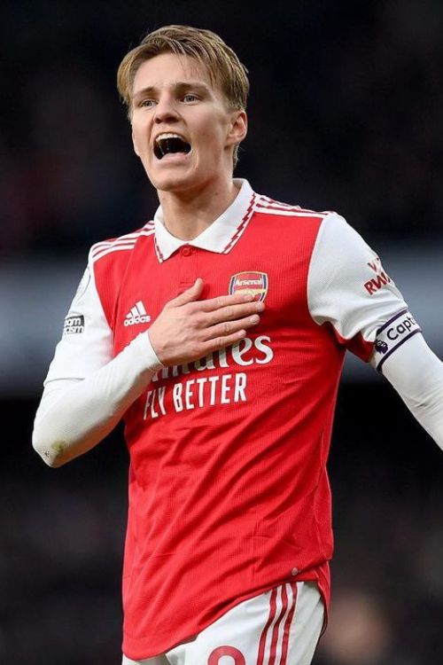 Martin Odegaard Touches The Arsenal Crest On His Shirt As He Celebrates Beating Bournemouth