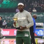 Jrue Holding A Trophy