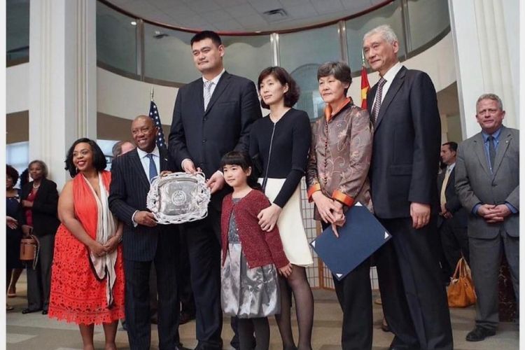 Yao Ming Pictured With His Dad And Mom(Right) And His Wife And Their Daughter During A Ceremony