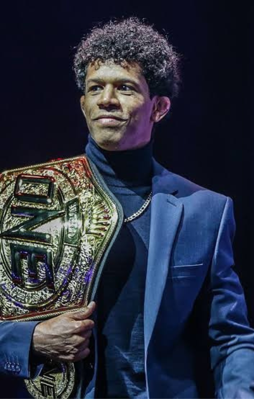 Adriano Moraes Carrying His Winning Belt