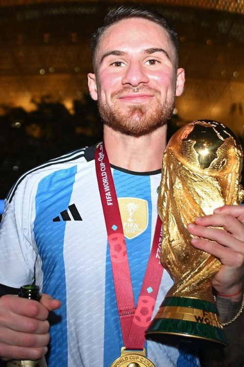 Mac Allister With FIFA World Cup Trophy