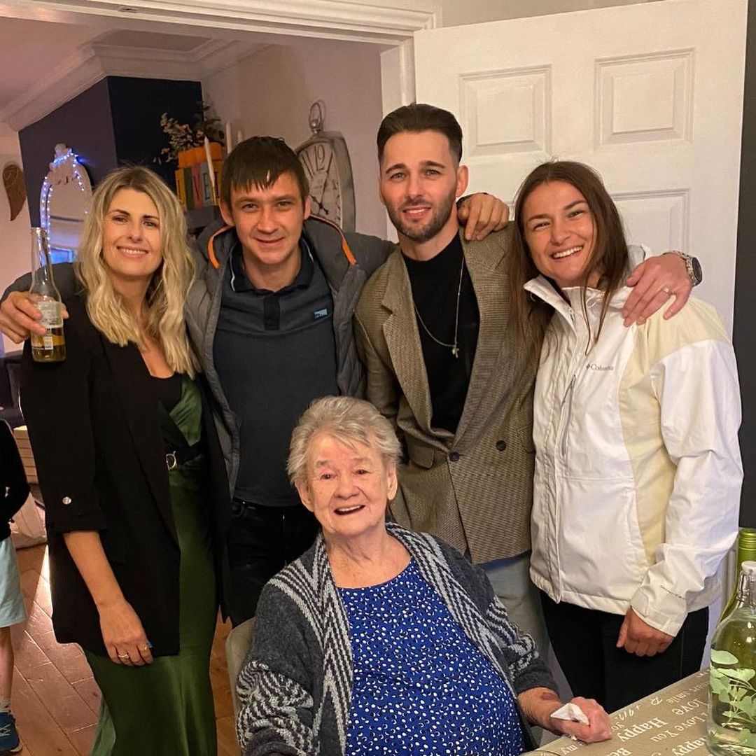 Katie With Her Siblings And Grandma