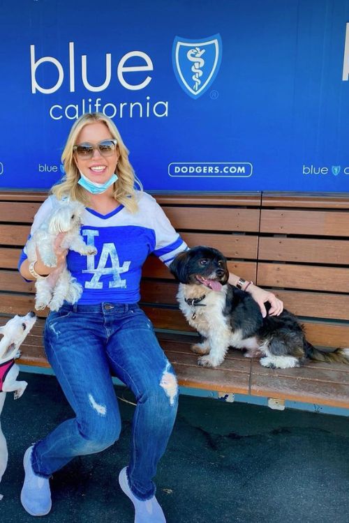 Jeanie Buss With Dogs