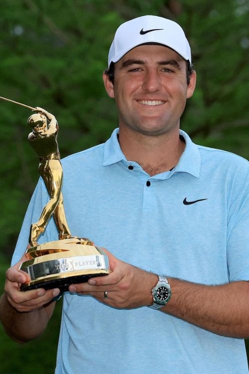 Scottie Scheffler Holding A Trophy 