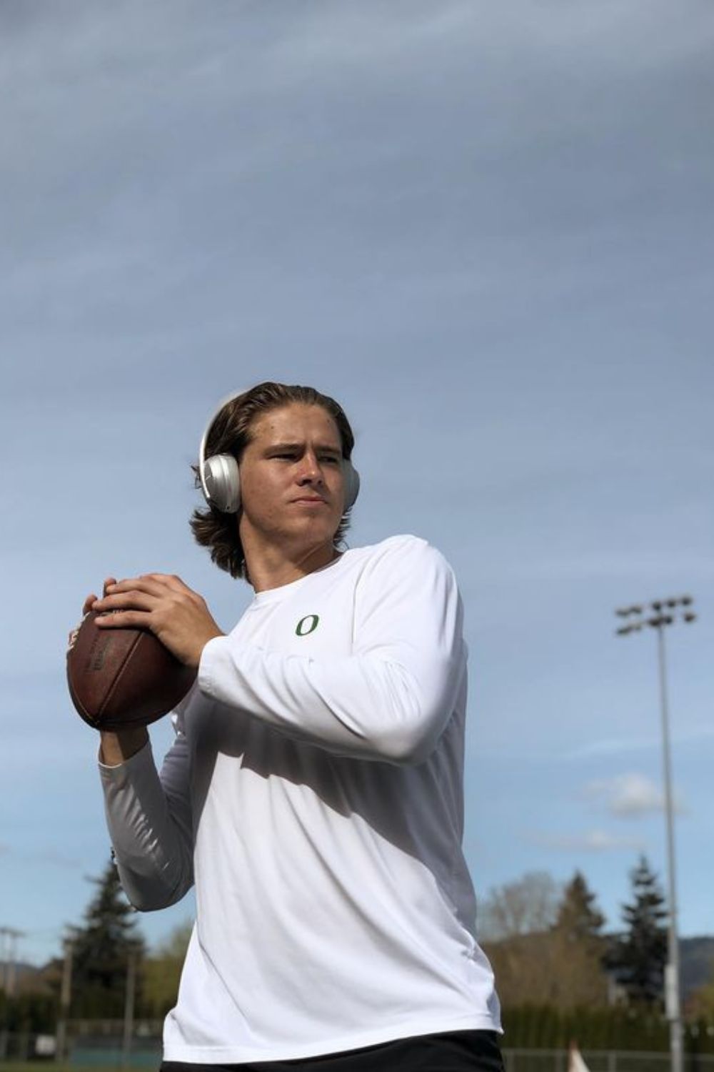 Justin Herbert Practicing American Football