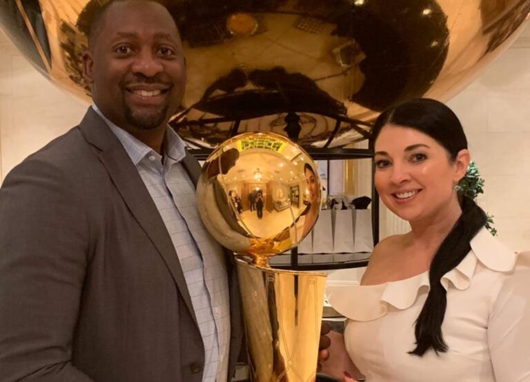 Adrian Griffin Pictured With His Wife Kathy Griffin Holding The NBA Trophy In 2019