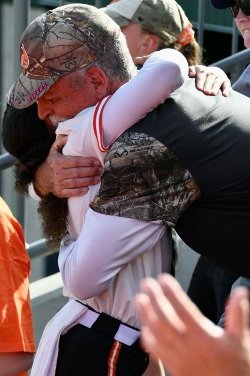 McKenzie Clark Hugs Her Father Brian During A Baseball Tournament