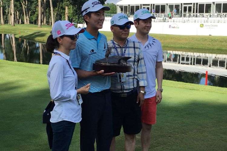 Michael Kim Poses With His Family After Winning John Deere Classic Tournament 