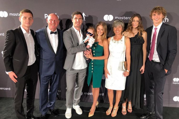 Mischa Zverev(Grey Suit) Pictured With His Family Including His Wife Evgenia And Their Son In 2019