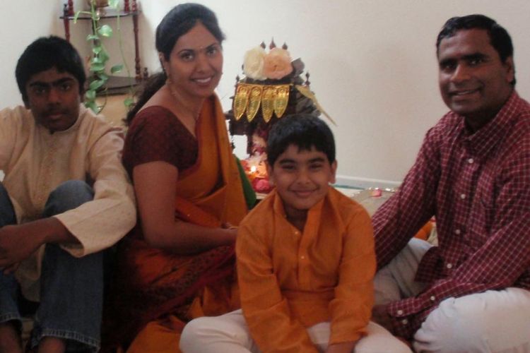 Sahith (Left) Poses For A Picture With His Family As They Complete Their Puja