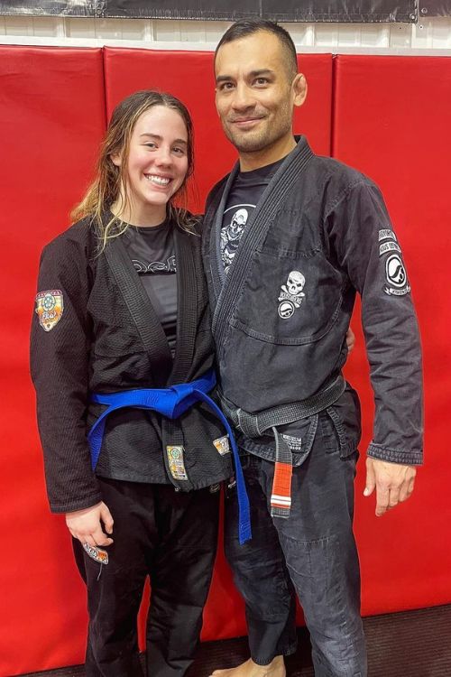 Shaile Lipp With Her Trainer Poses At The Academy of Combat Arts In December 2022