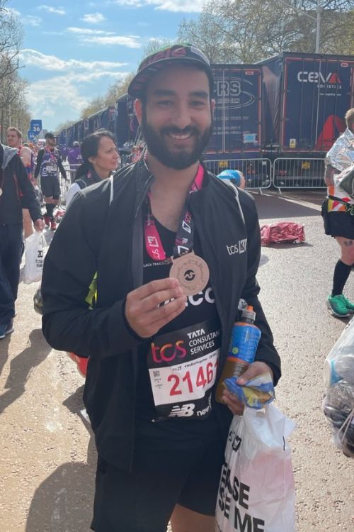 Ashley Walcott Shows Off His Finisher's Medal After Completing London Marathon In April 2023