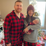 Chris Buescher with his wife and baby