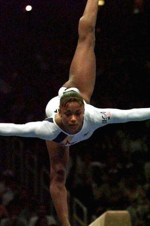 Dominique Dawes During Her Performance At Atlanta Games In 1996 (Source: NPR)