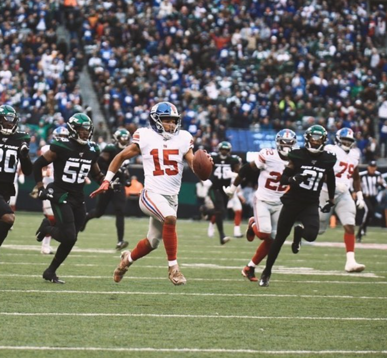 Golden Tate playing in the NFL donning jersey no.15