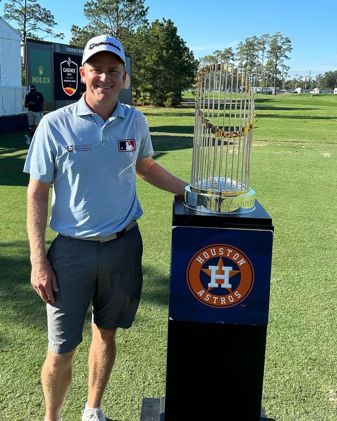 Adam Posing Infront Of Trophy 