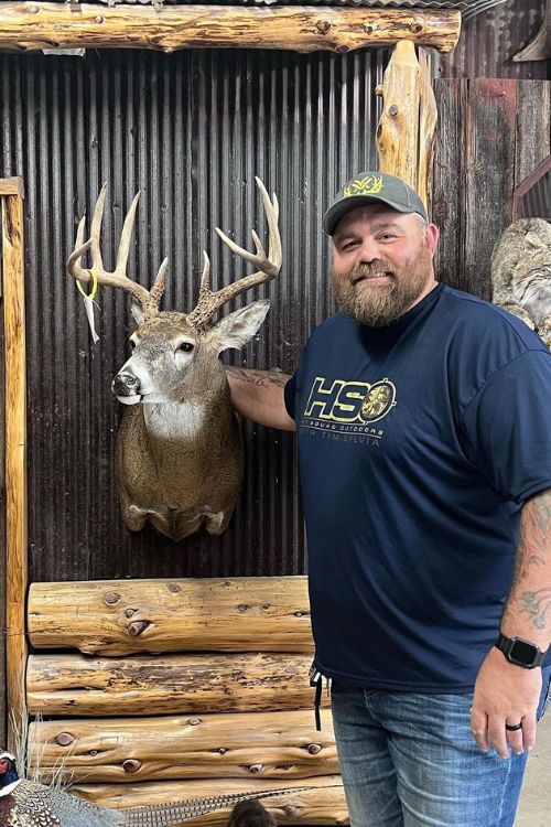 Tim Sylvia Standing With His Tropy