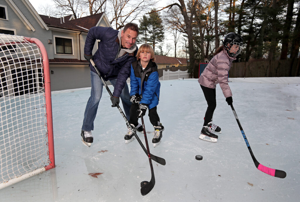 Bruce teaching His Son Cole Ice Hockey