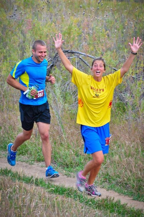 Courtney Dauwalter Pictured Waving To The Camera As Kevin Tags Along Behind Her During Their Training Session