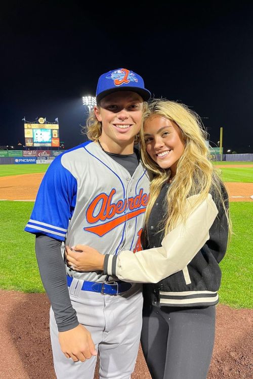 Jackson Holliday, left, the first overall draft pick by the Baltimore  Orioles in the 2022 draft, and his girlfriend Chloe Cox attend a news  conference introducing him prior to a baseball game