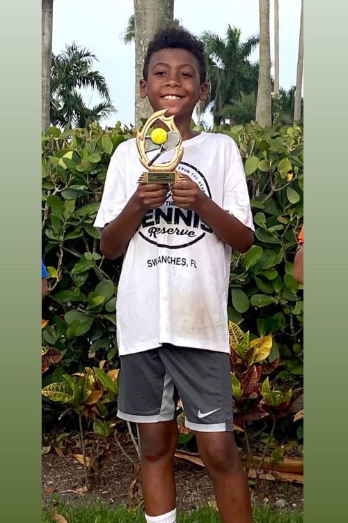 Miko Grimes Shows Her Son's Tennis Achievement In A Photo Shared In 2021