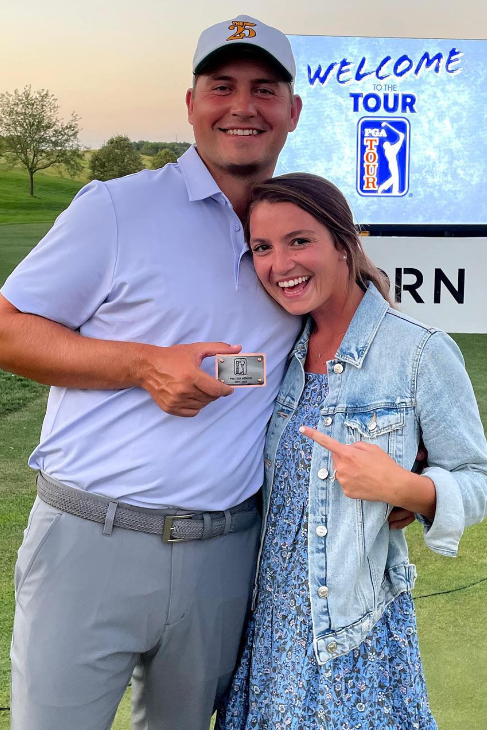 Andrew Novak And His Wife Posing With His PGA Tour Card