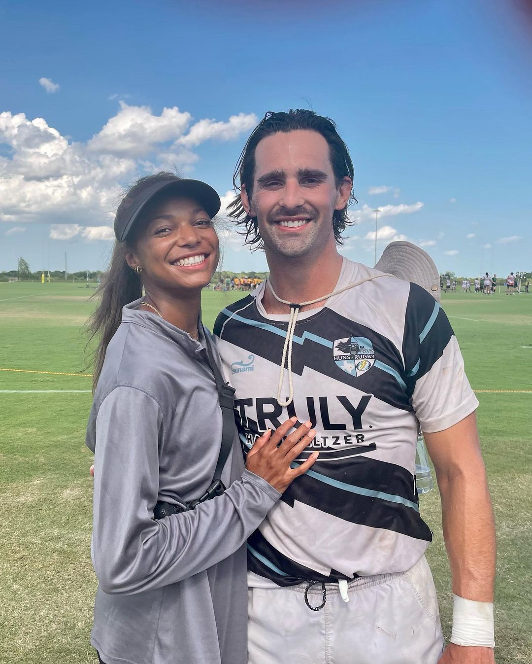Gabrielle And Spencer Pictured At A Rugby Field