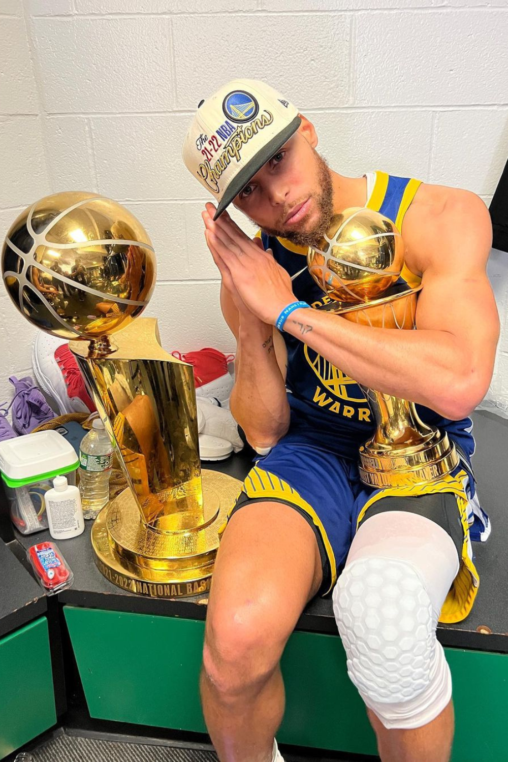 Stephen Curry Celebrating Alongside His Trophies