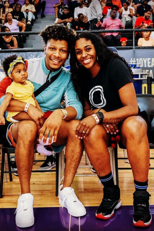 Kevin And Cheynne Pictured With Their Daughter, Naomi At A WNBA Game In 2022