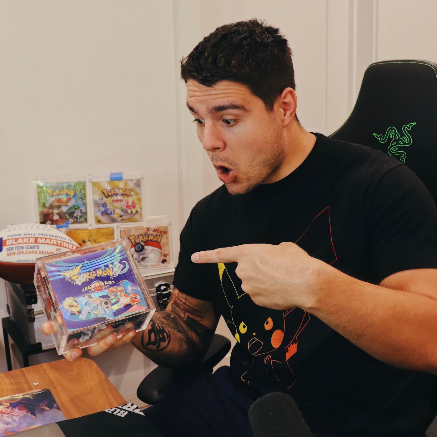 Blake Martinez With Pokemon Packs In His Hand