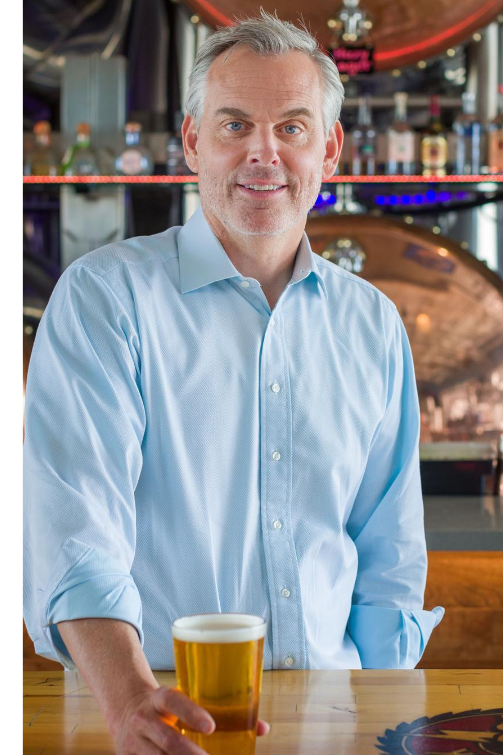 Colin Cowherd Holding A Glass Of Beer In His Hand