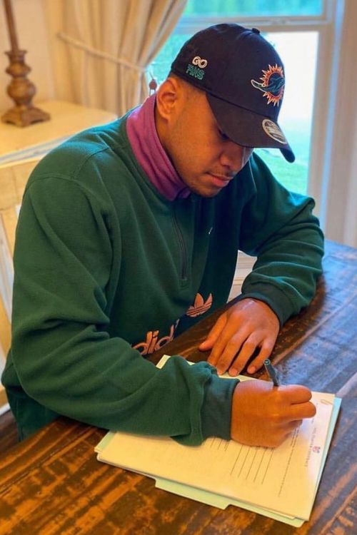 Tua Tagovailoa Signing His Contract For The Dolphins