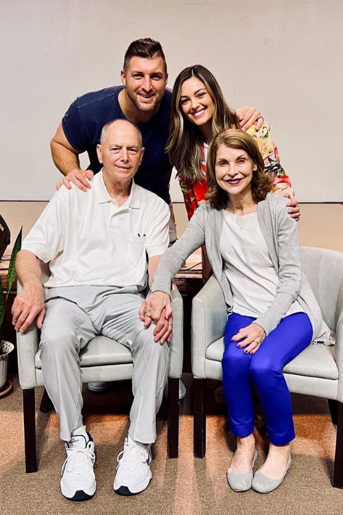 Tim With His Parents And Wife