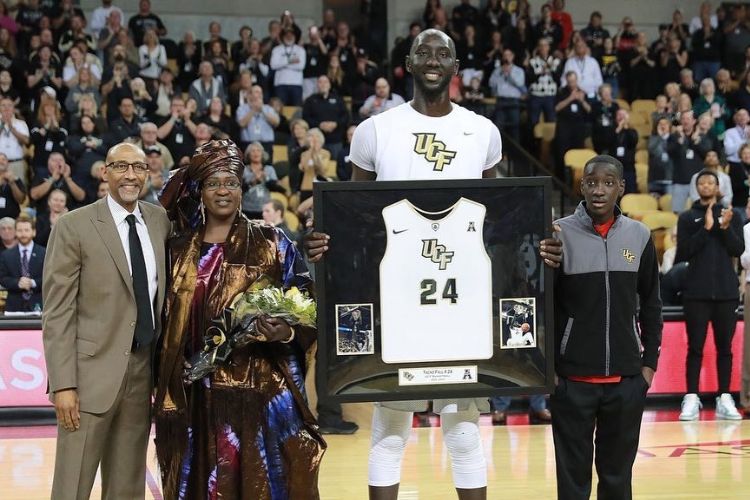 Tacko Fall Pictured With His Mother, Marianne Sene, And His Brother In 2019 As He Is Honored During A Game Between  UCF And Cincinnati 