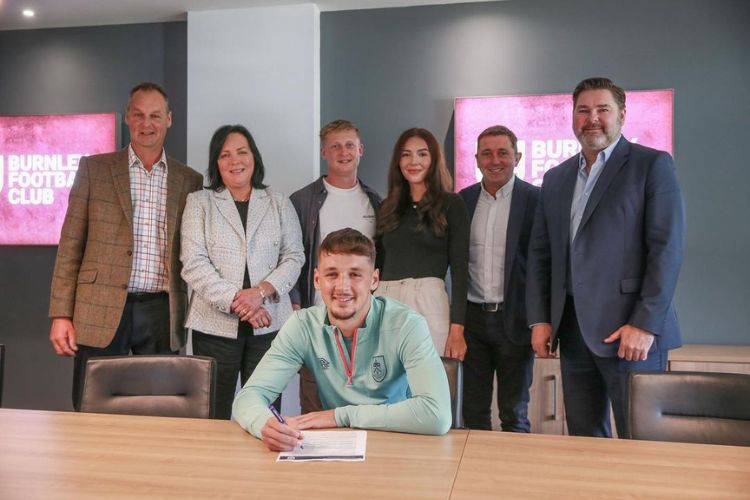 James Trafford Pictured Signing For Burnley With His Parents, Amy, And James (L) In The Background 