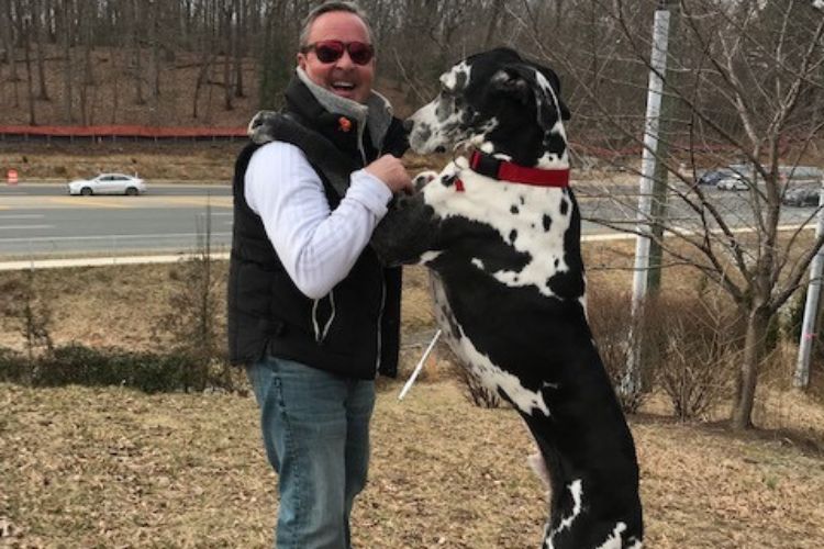 Ali Krieger's Father, Ken Krieger Pictured Playing With His Pet Dog In A Pictured Shared In 2019